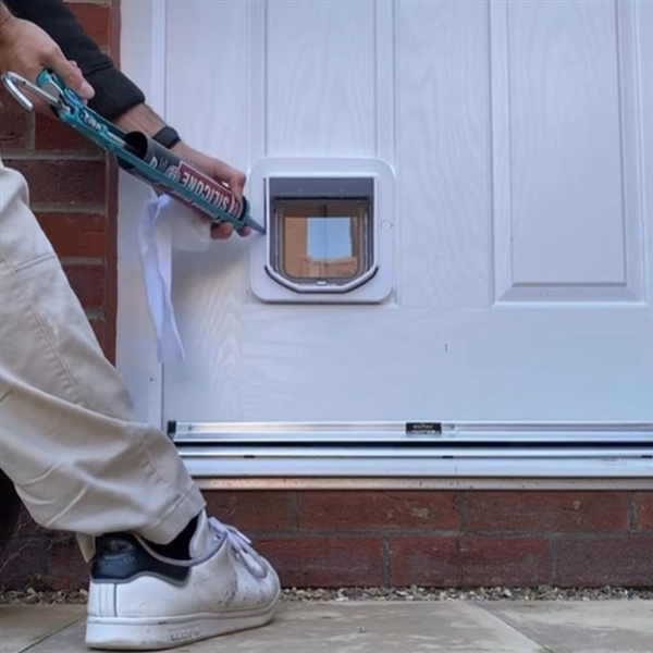 fitting and sealing a pet flap in a UPVC door